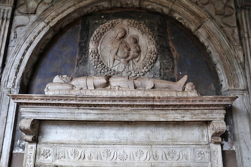 Naples, Campania, Italy - December 27, 2022: Funerary monument of Matteo Ferrillo in the small cloister of the Church of Santa Maria La Nova where the remains of Count Dracula are believed to be kept