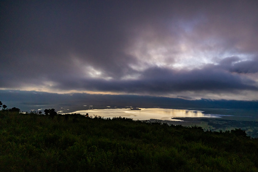 Scenic view of lush green landscape of the outer crater slopes of the Ngorongoro Crater, Africa