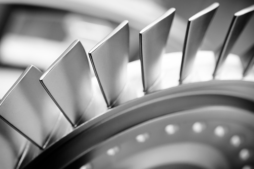 Steel blades of turbine propeller. Close-up view. Selected focus on foreground, industrial additive machinery technologies concept