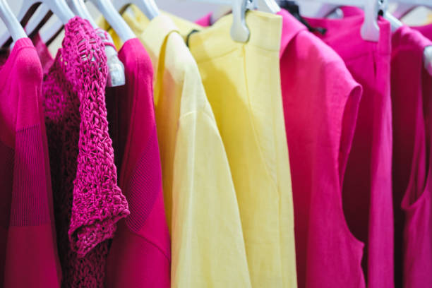 istock Multicolor family clothes on hangers in store 1858084650