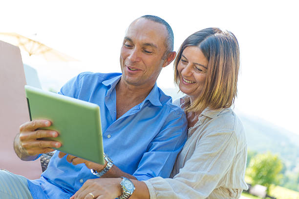istock Happy couple in relax with pad 185808706
