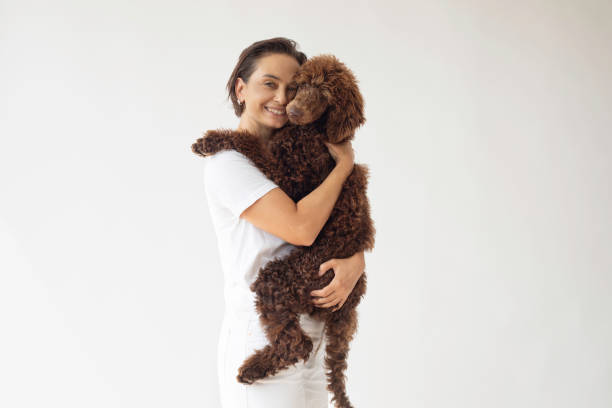 istock Woman and Poodle 1858098624