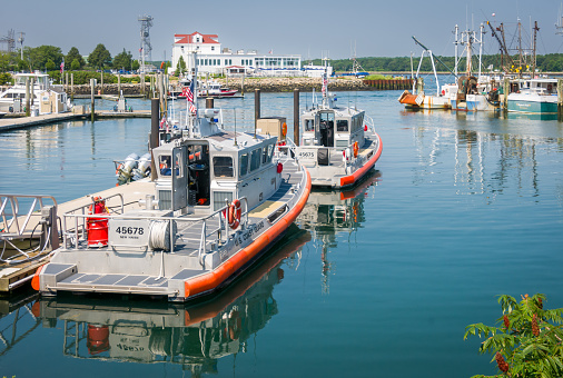 Sandwich, Massachusetts, USA-July 21, 2021- A pair of Coast Guard patrol boats, one from New Haven , Connecticut and the other from the Cape cod Canal are docked in the Sandwich Marina on a July morning.