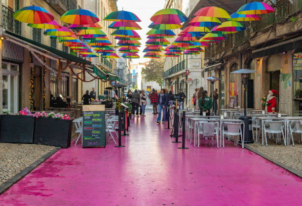 Famous Pink street with colorful umbrellas in Lisbon stock photo