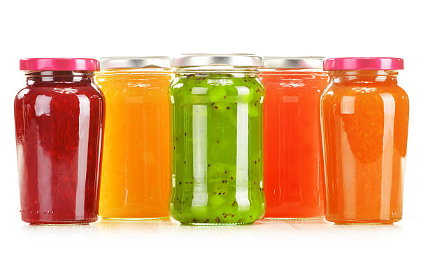istock Five jars of fruit jelly isolated on white 185811183