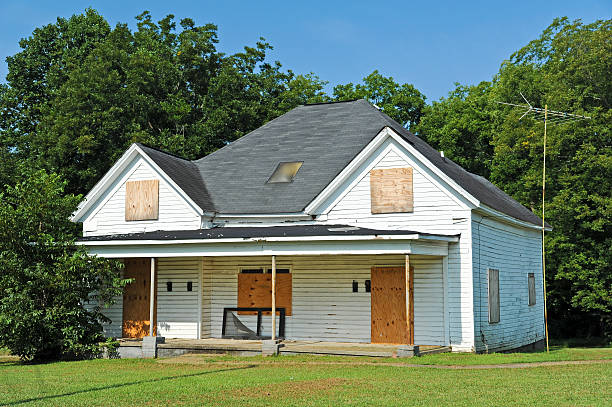 Abandoned House Abandoned House with Boarded up Windows and Doors bad condition stock pictures, royalty-free photos & images