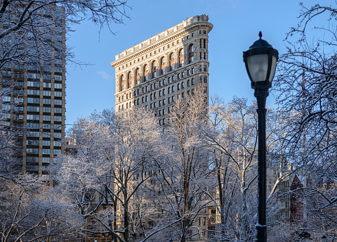 Winter view of Flatiron building from Madison Square Park in New York City midtown Manhattan