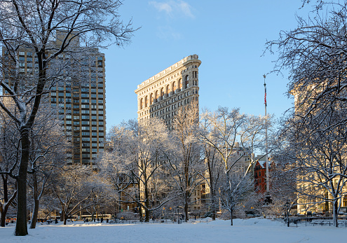 Winter view of Flatiron building from Madison Square Park in New York City midtown Manhattan