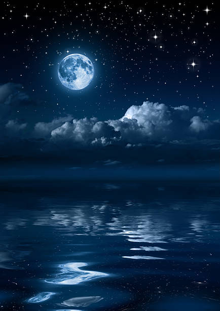 istock moon and clouds in the night on sea 185812118