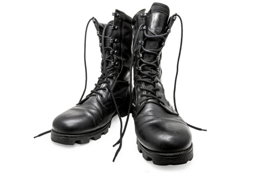 Black army shoes isolated on a white background. Frontal