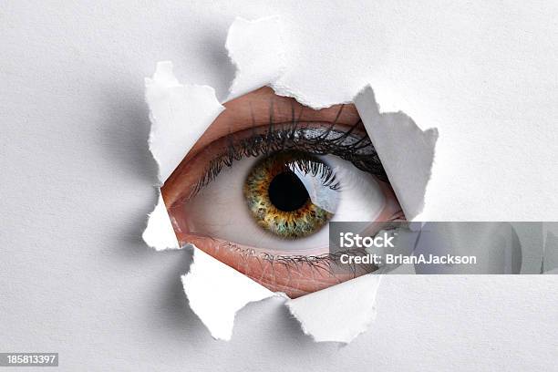 Looking Through A Hole In White Paper Stock Photo - Download Image Now - Peephole, Paper, Hole