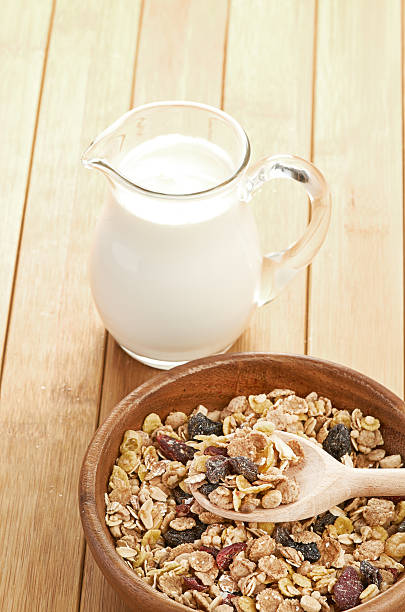 istock Plate with raw oatmeal on wooden table. 185817461