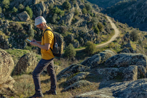istock Hiker searching for the route on his mobile phone. 1858187480