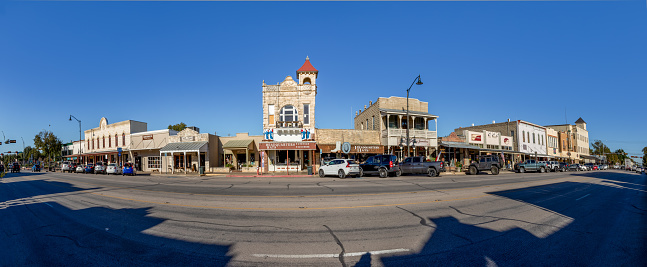 Fredericksburg, USA - November 1, 2023: The Main Street in Fredericksburg, Texas, also known as The Magic Mile, with retail stores and people walking.