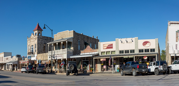 Fredericksburg, USA - November 1, 2023: The Main Street in Frederiksburg, Texas, also known as The Magic Mile, with retail stores and people walking.