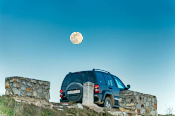SUV travels through the mountain forest