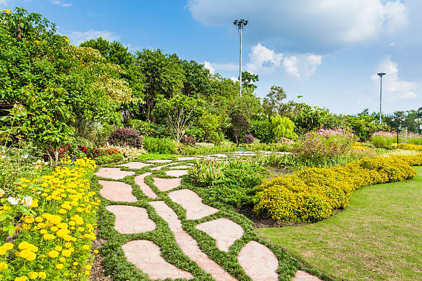 istock Colourful Flowerbeds and Winding Grass Pathway in an Attractive 185822891
