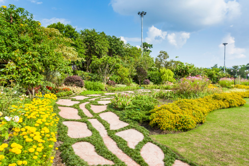 Colourful Flowerbeds and Winding Grass Pathway in an Attractive