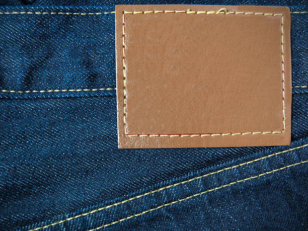 istock Leather jeans label sewed on jeans. 185822992
