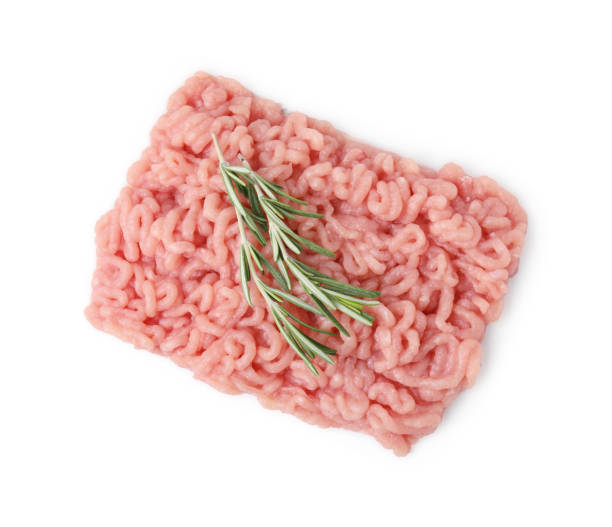 istock Fresh raw minced meat and rosemary isolated on white, top view 1858246657
