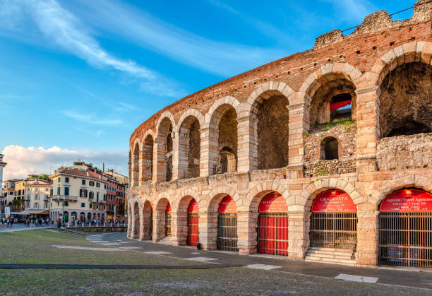 The Roman Arena in Piazza Bra, Verona, Italy Verona, Italy - May 24 2018: View of the Roman Arena in Piazza Bra. Built in the first century, it is still in use today and is famous for the large-scale opera performances given there. verona opera stock pictures, royalty-free photos & images