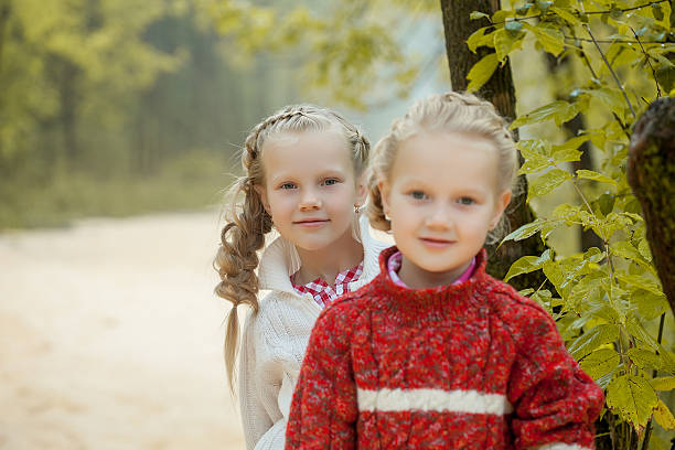 istock Image of two lovely girlfriends posing in park 185831499