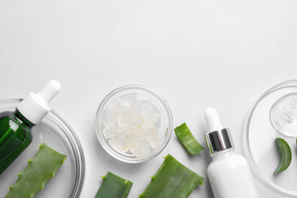 istock Flat lay composition with cosmetic products and cut aloe vera on white background. Space for text 1858328781