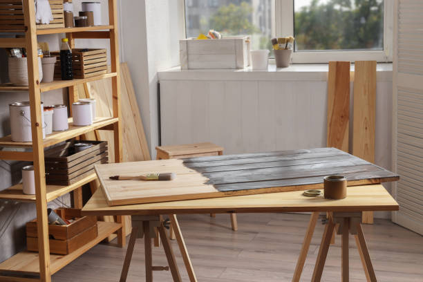 istock Applying wood stain. Different equipment in workshop 1858335922