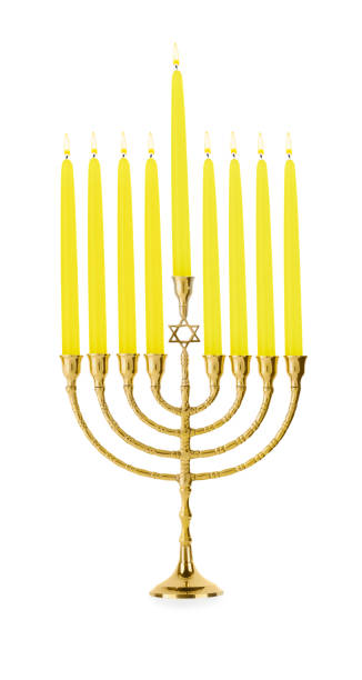 istock Hanukkah celebration. Menorah with yellow candles isolated on white 1858339523