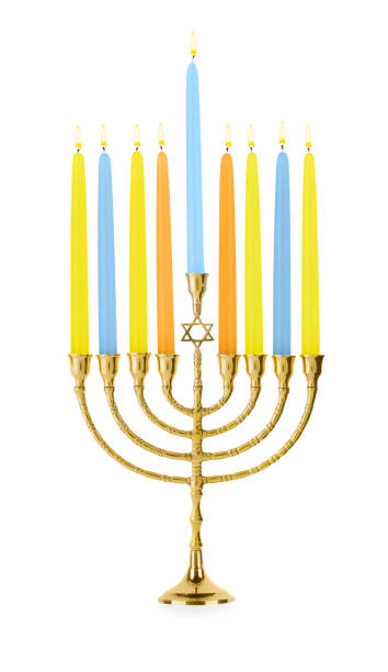 istock Hanukkah celebration. Menorah with colorful candles isolated on white 1858339524