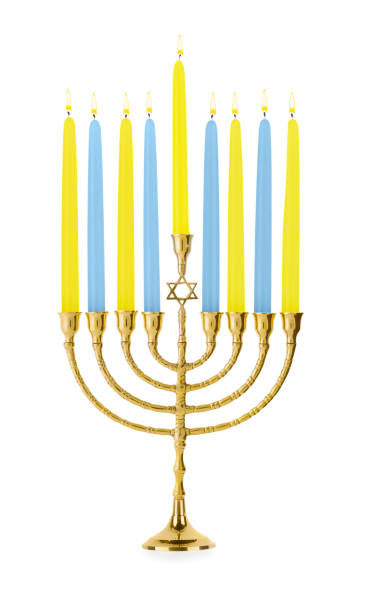 istock Hanukkah celebration. Menorah with colorful candles isolated on white 1858339529