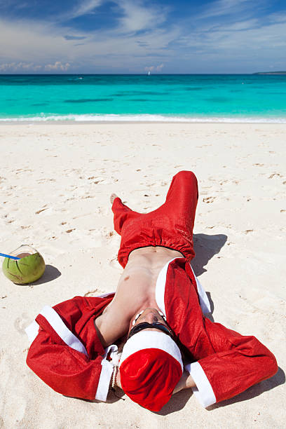 istock Santa Claus on beach relaxing 185834374