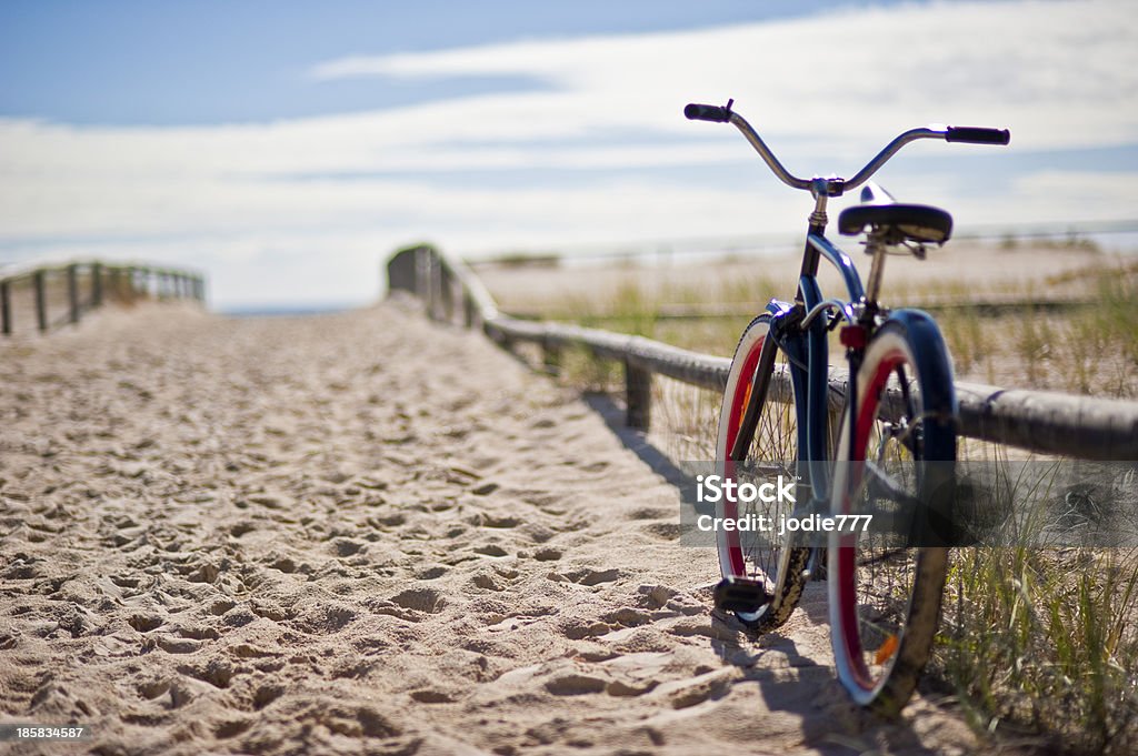 bike left at the beach Sunny day at the beach with a bike Bicycle Stock Photo