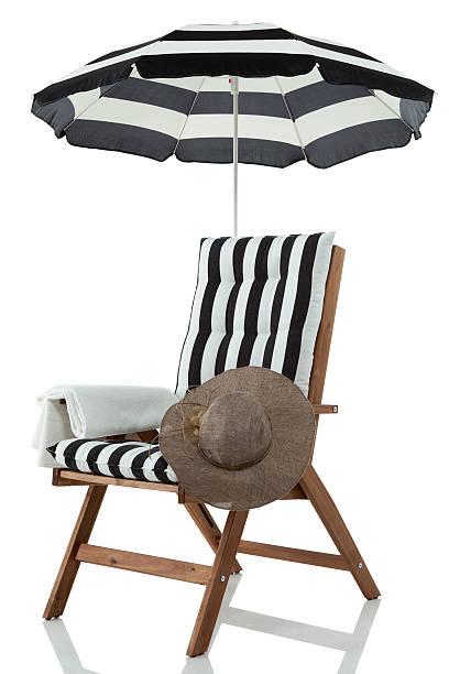istock Beach Chair with Umbrella and hat 185836644