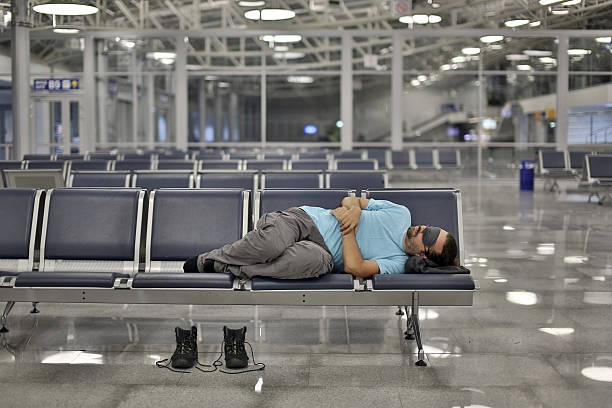 istock sleeping in airport with eye cover 185837865
