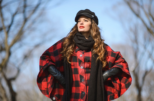 Fashionable young woman posing in Central Park in winter
