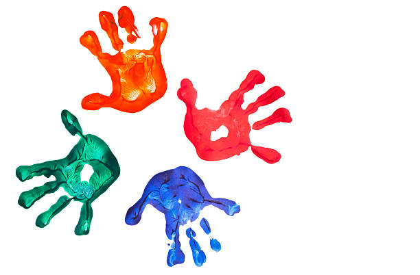 Imprint of four children's hands stock photo