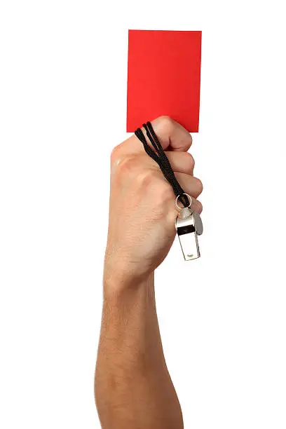 Human Hand with whistle, red card, Isolated on white background.