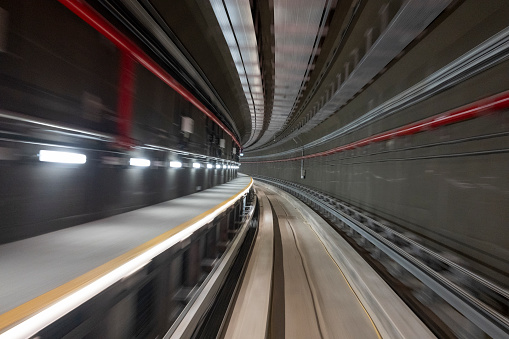 Motion blur of train moving to City stock photo