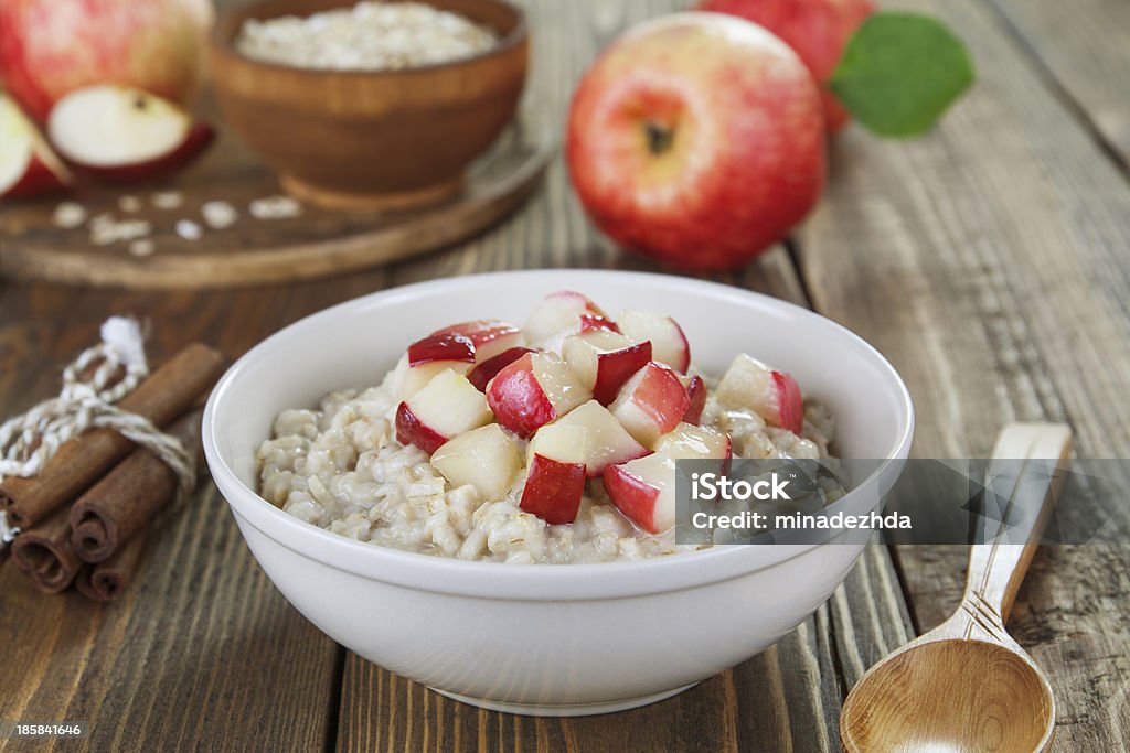 Oatmeal with caramelized apples Porridge with caramelized apples on the table Apple - Fruit Stock Photo