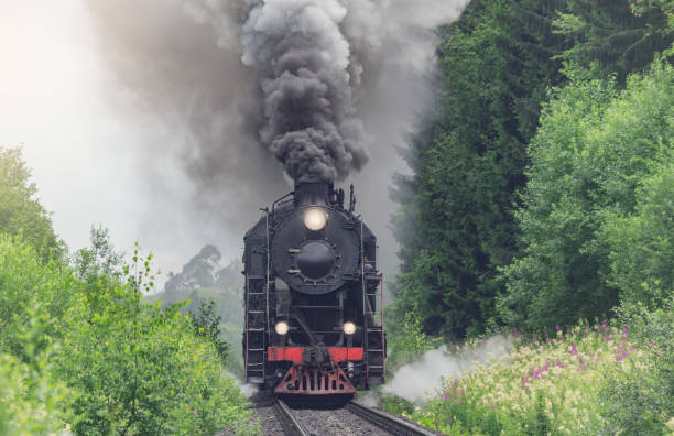 istock Retro steam train approaches to the platform. 1858424637