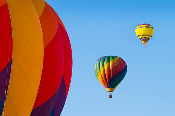 istock Airborne hot-air balloons with one in foreground 185844004