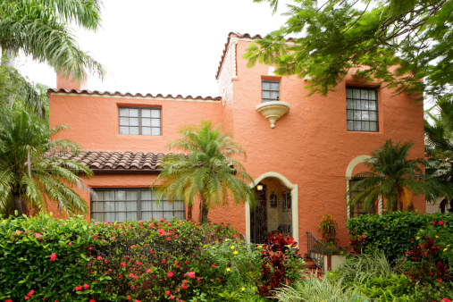 Stock image of a two story Spanish style house in South Florida