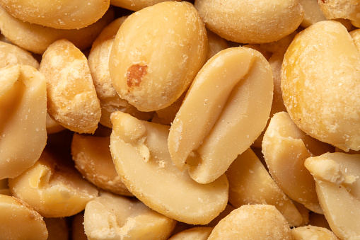 A close up look at some peanuts out of the shell