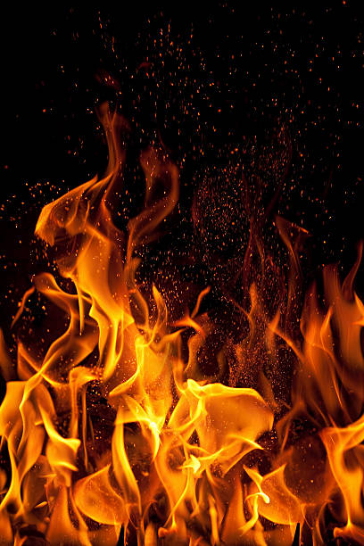 istock flame and sparks isolated over black background 185848223