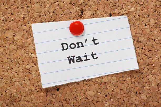 istock Don't Wait typed on notepaper tacked to a bulletin board 185850148