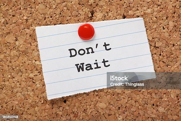 Dont Wait Typed On Notepaper Tacked To A Bulletin Board Stock Photo - Download Image Now