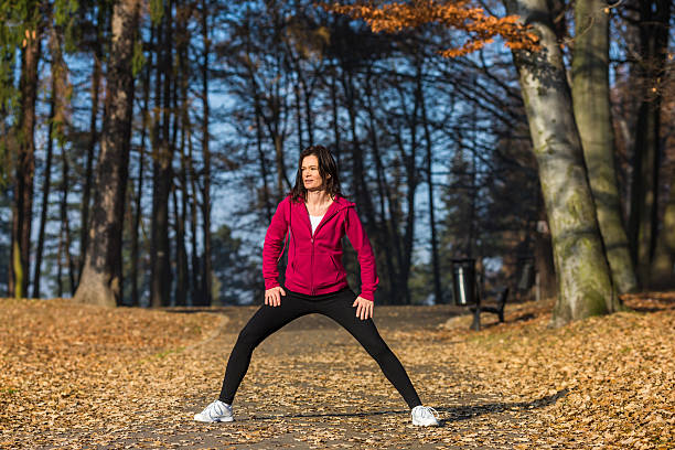 istock Woman jogging in park 185852295
