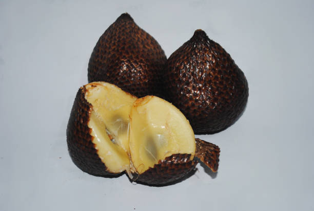Snake fruit, also known as salak, is a rare species of palm tree native to Indonesia. The fruit is named for the scaley outer skin of the fig-shaped fruit