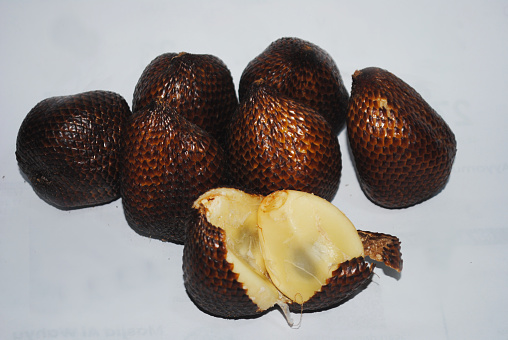 Snake fruit, also known as salak, is a rare species of palm tree native to Indonesia. The fruit is named for the scaley outer skin of the fig-shaped fruit